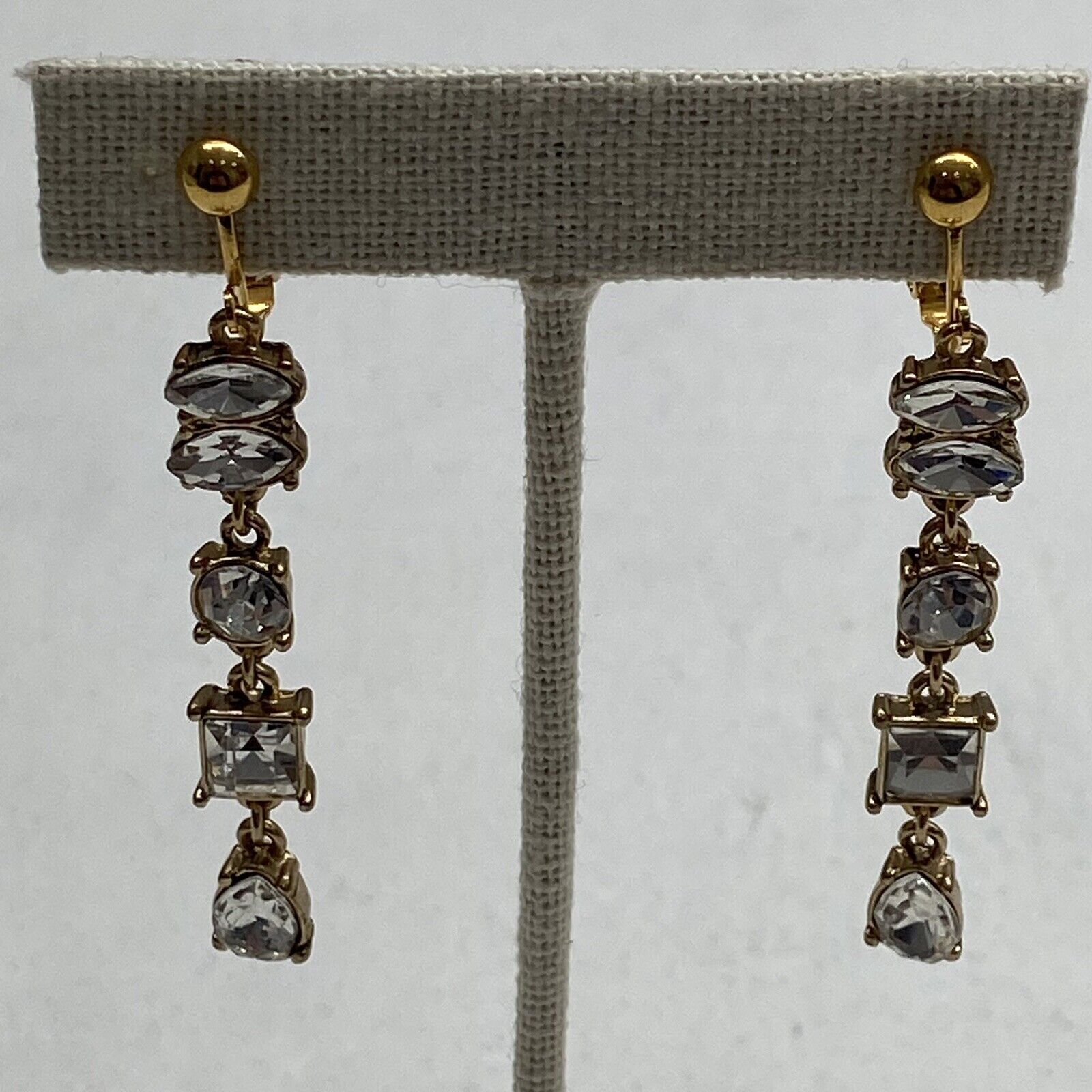 Gold Tone and Crystal Dangle Four Drop Clip On Earrings
